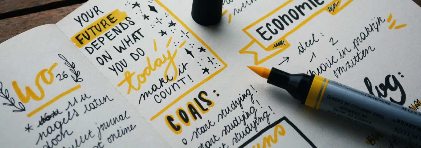 notebook with yelow and black writing