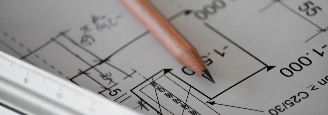 pencil laying on paper with math equations