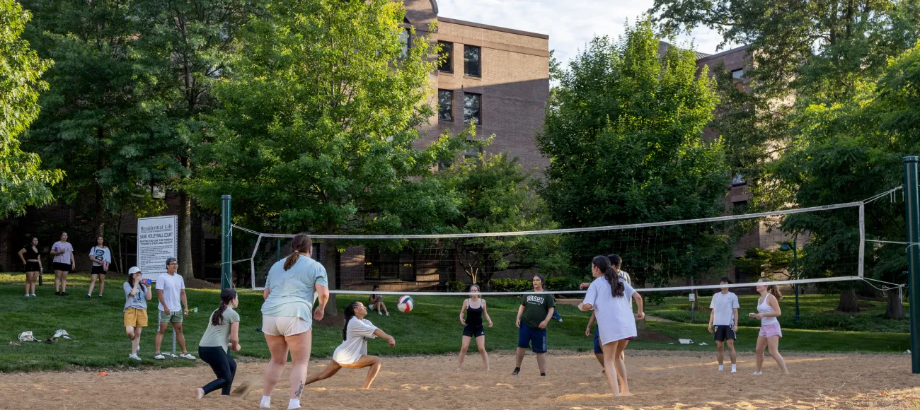 "students playing volleyball"