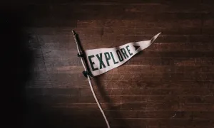 white flag with the word explore written in bold dark letters
