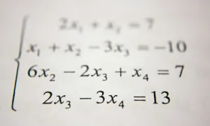 series of math equations on white paper