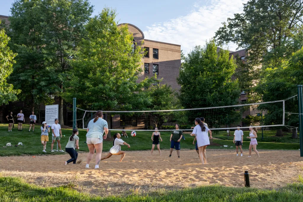 "students playing volleyball"
