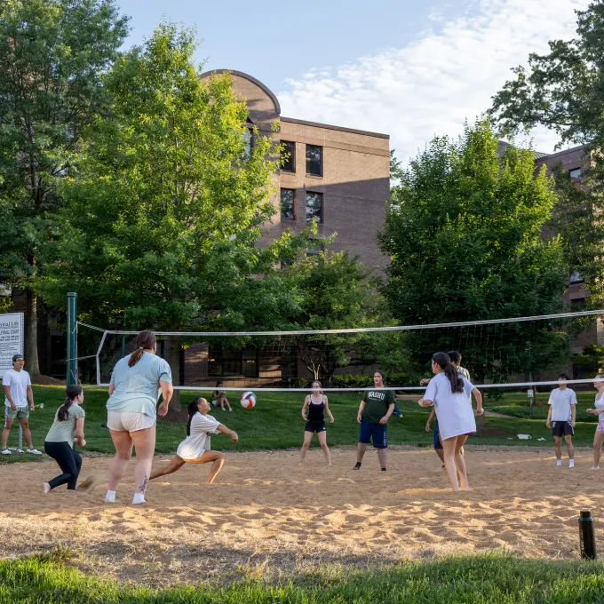 "students playing volleyball"