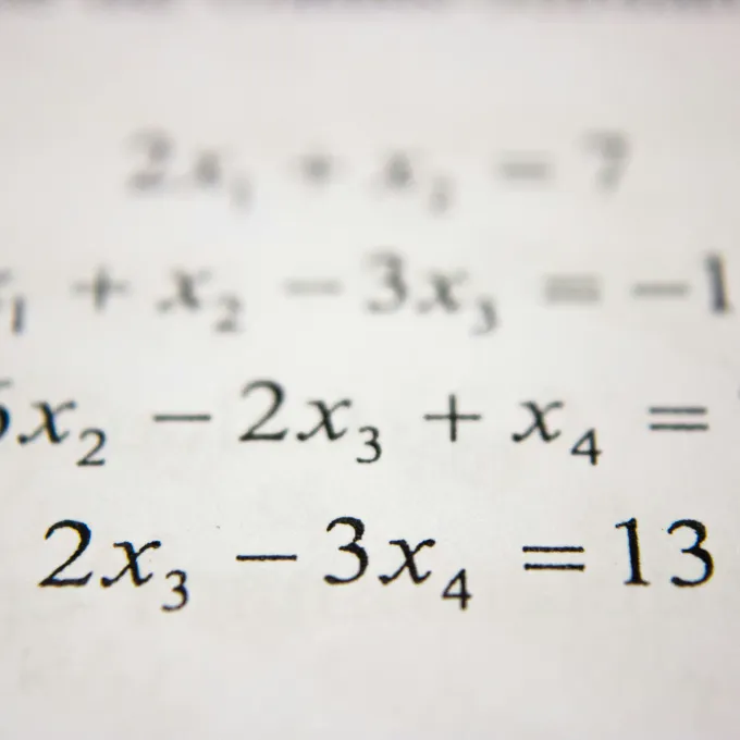 series of math equations on white paper